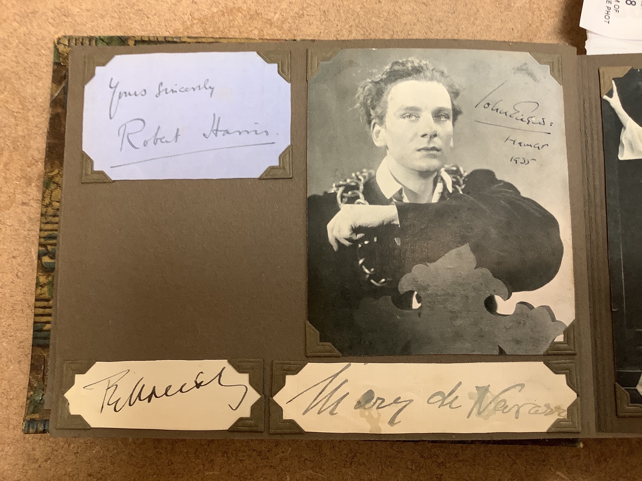 An album of 1930s monochrome postcards including film stars, some signed, letter and other signatures